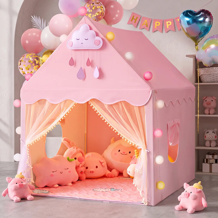 Enchanting pink princess play tent shaped like a house, featuring scalloped trim, pom-pom edging, and sheer mesh curtains at the entrance. Decorated with a cloud appliqué and balloons, it&