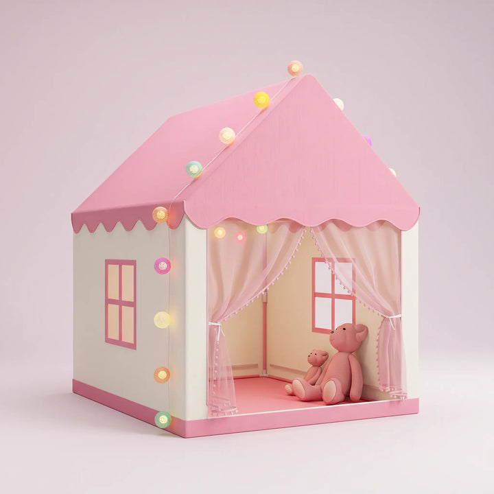 Pink and white house-shaped play tent with a scalloped pink roof, curtained entrance with mesh, and colorful LED fairy lights, featuring two pink teddy bears inside.