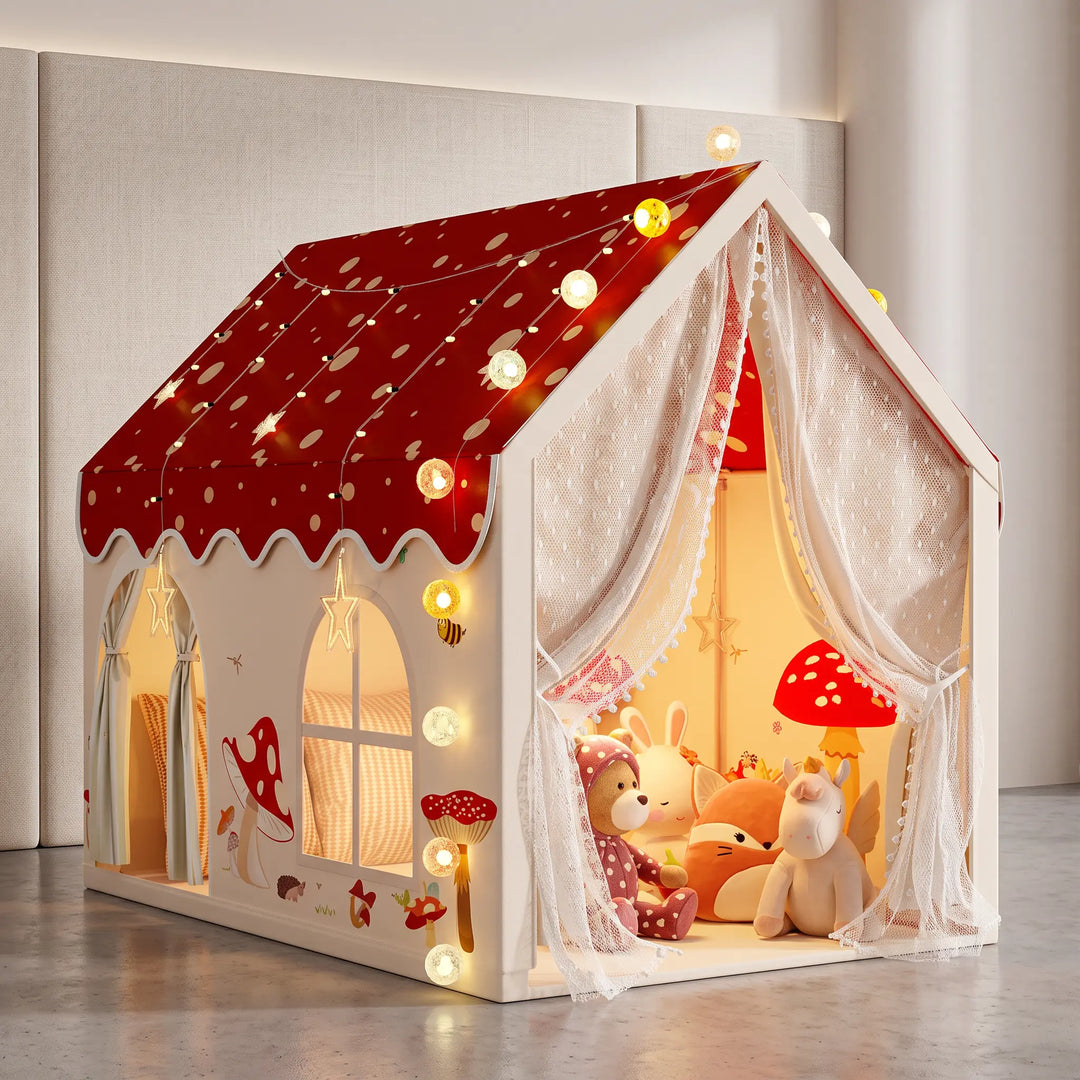 ToyHare Magical Mushroom play tent set up on a child's bed, featuring a red polka dot roof with LED fairy lights, pink walls with mushroom illustrations, and lace-curtained double doors.